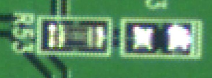 Photo of a printed circuit board taken with the Aptina 5 megapixel color sensor / Kowa JC10M lens, zoomed by 1950 percent